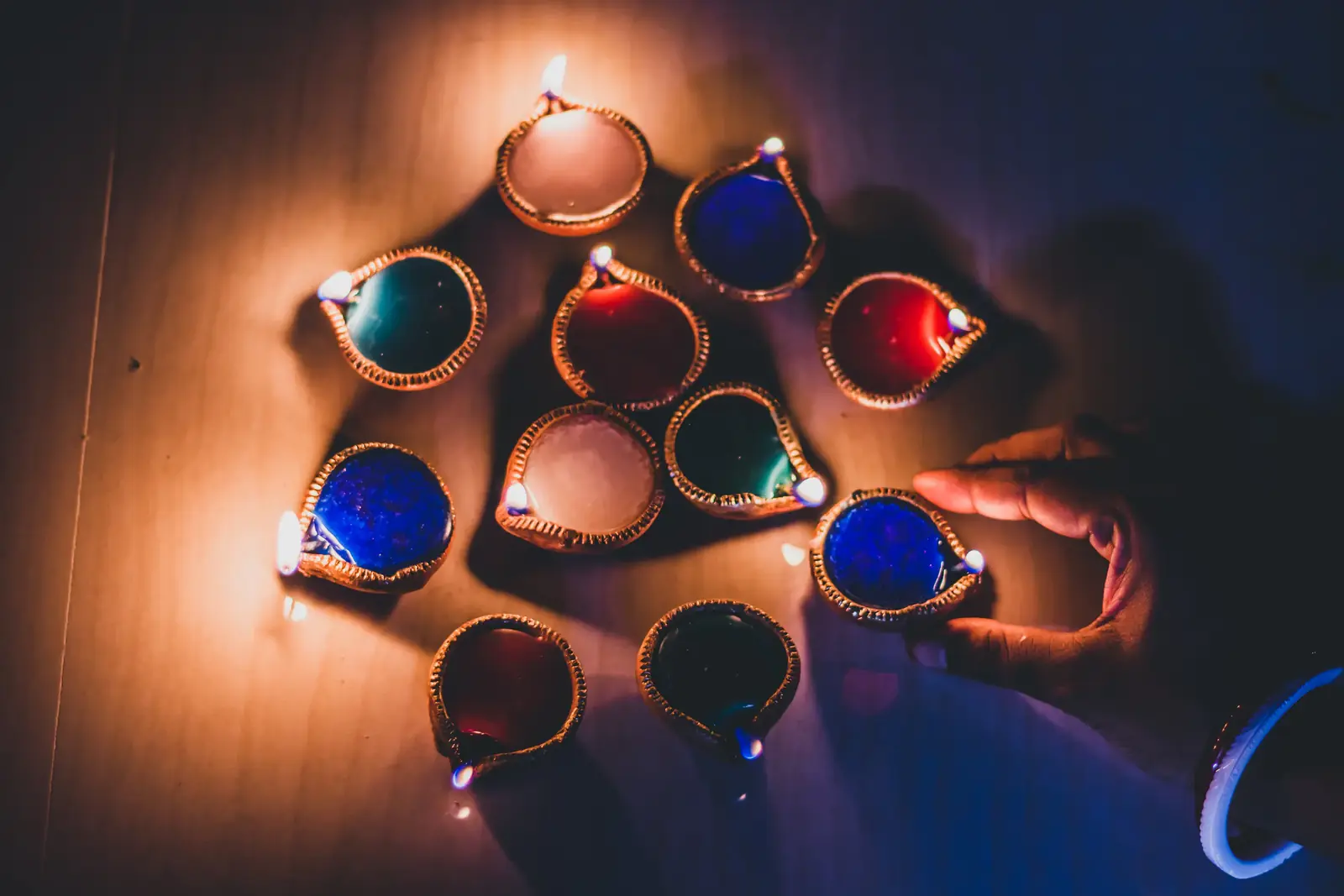 Glowing clay oil lamps arranged in the dark