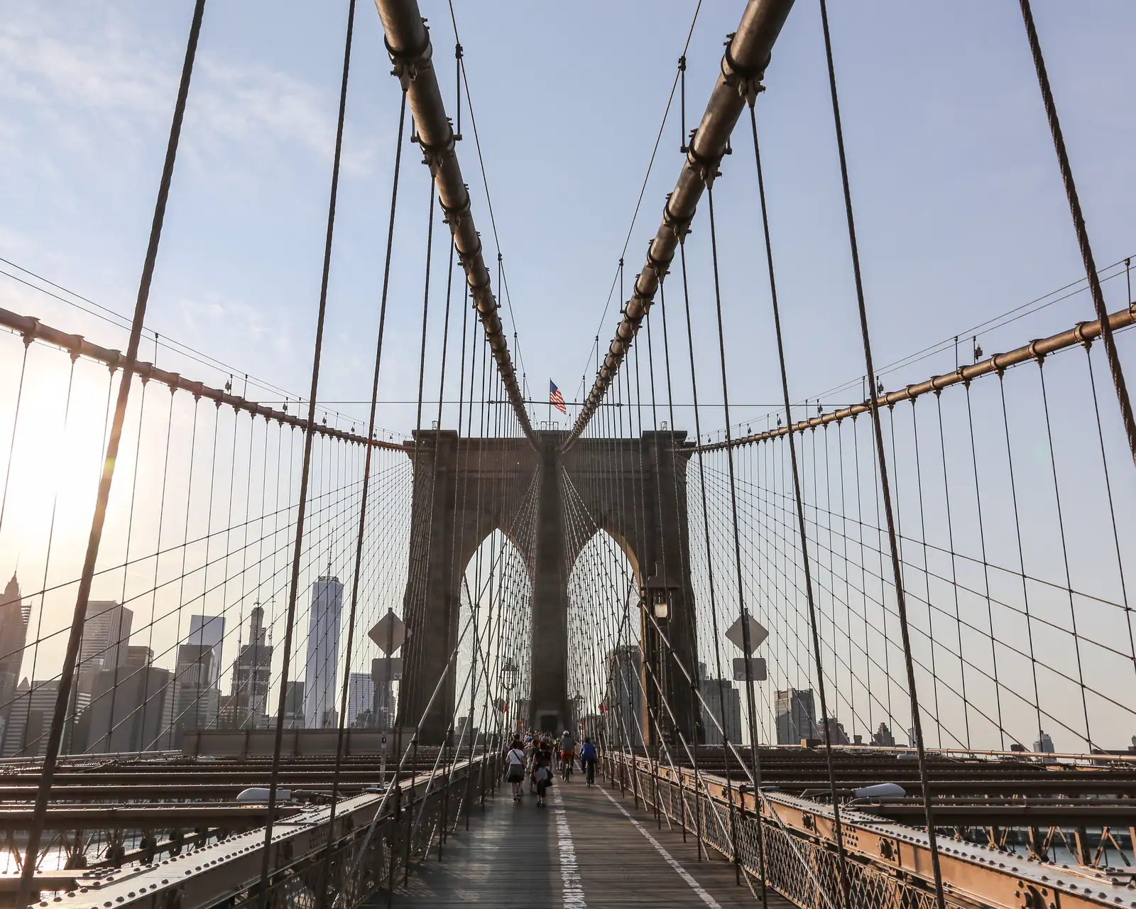 The Brooklyn Bridge walkway with the city skyline beyond