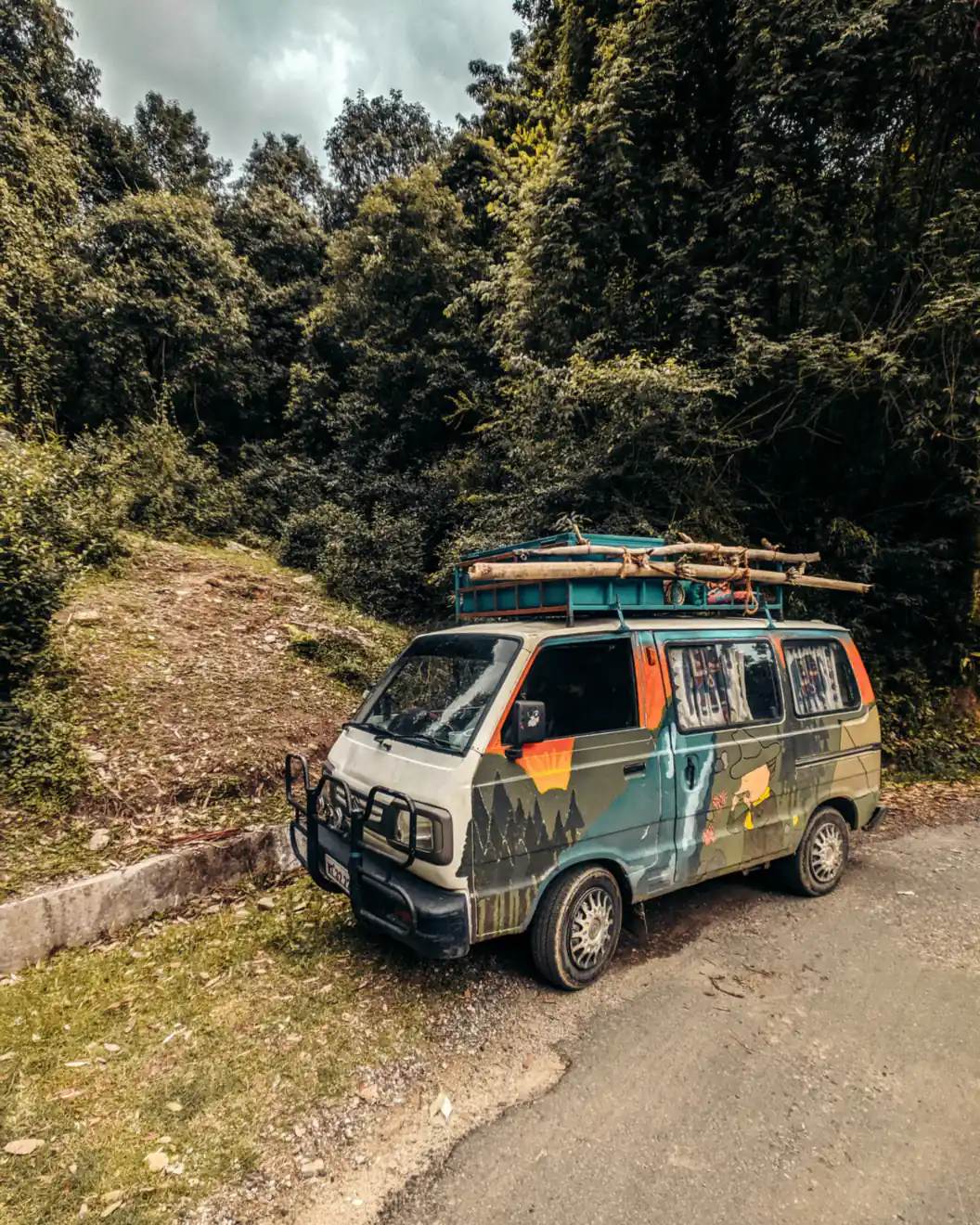 A camper van parked on a forest road