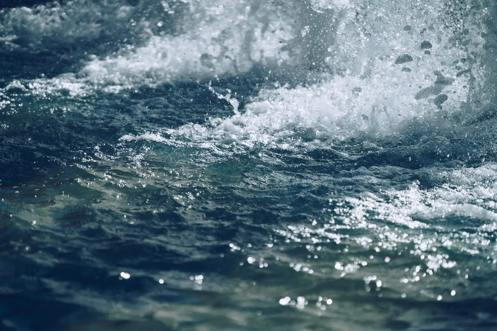 Churning blue sea, close up