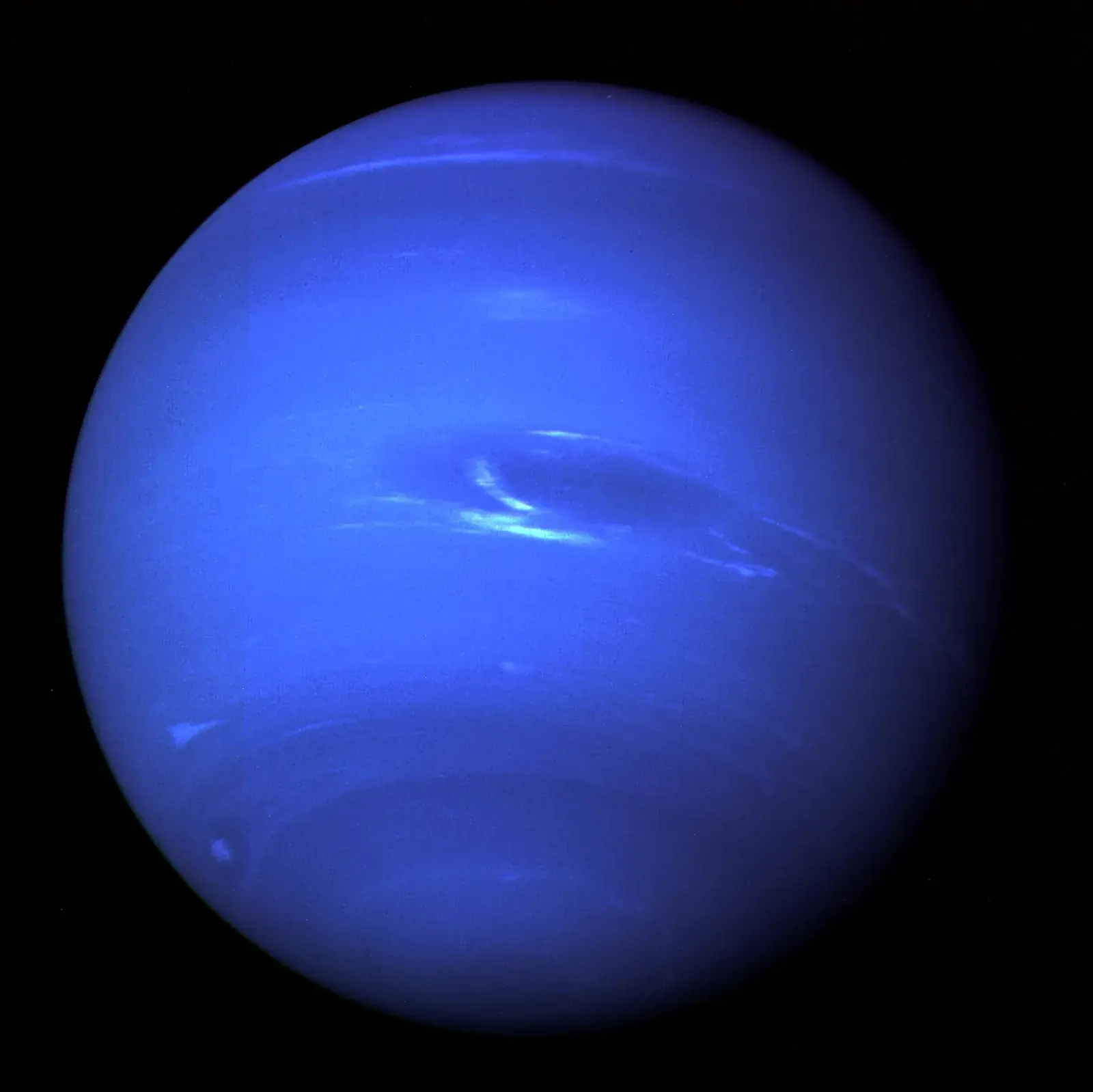 Voyager 2 photograph of Neptune, a deep blue globe with the Great Dark Spot and white methane clouds