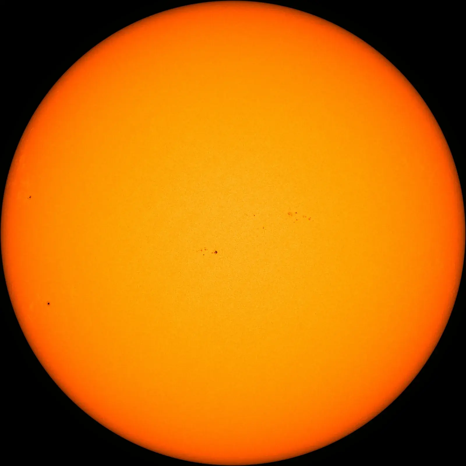 Solar Dynamics Observatory visible-light photograph of the Sun on 21 September 2026, an orange disc with small sunspot groups