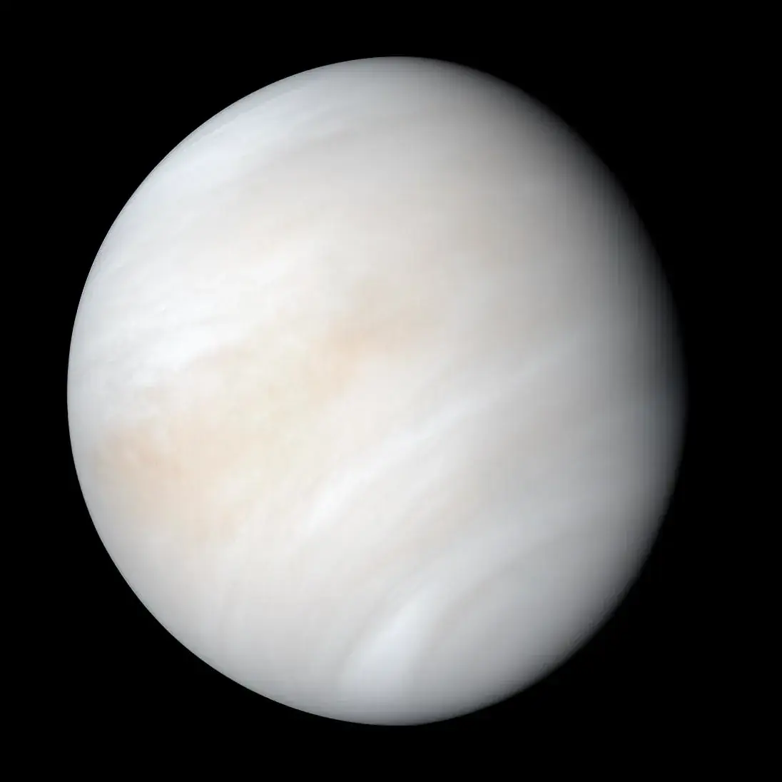 Mariner 10 view of Venus, a pale cream globe wrapped in swirling cloud bands