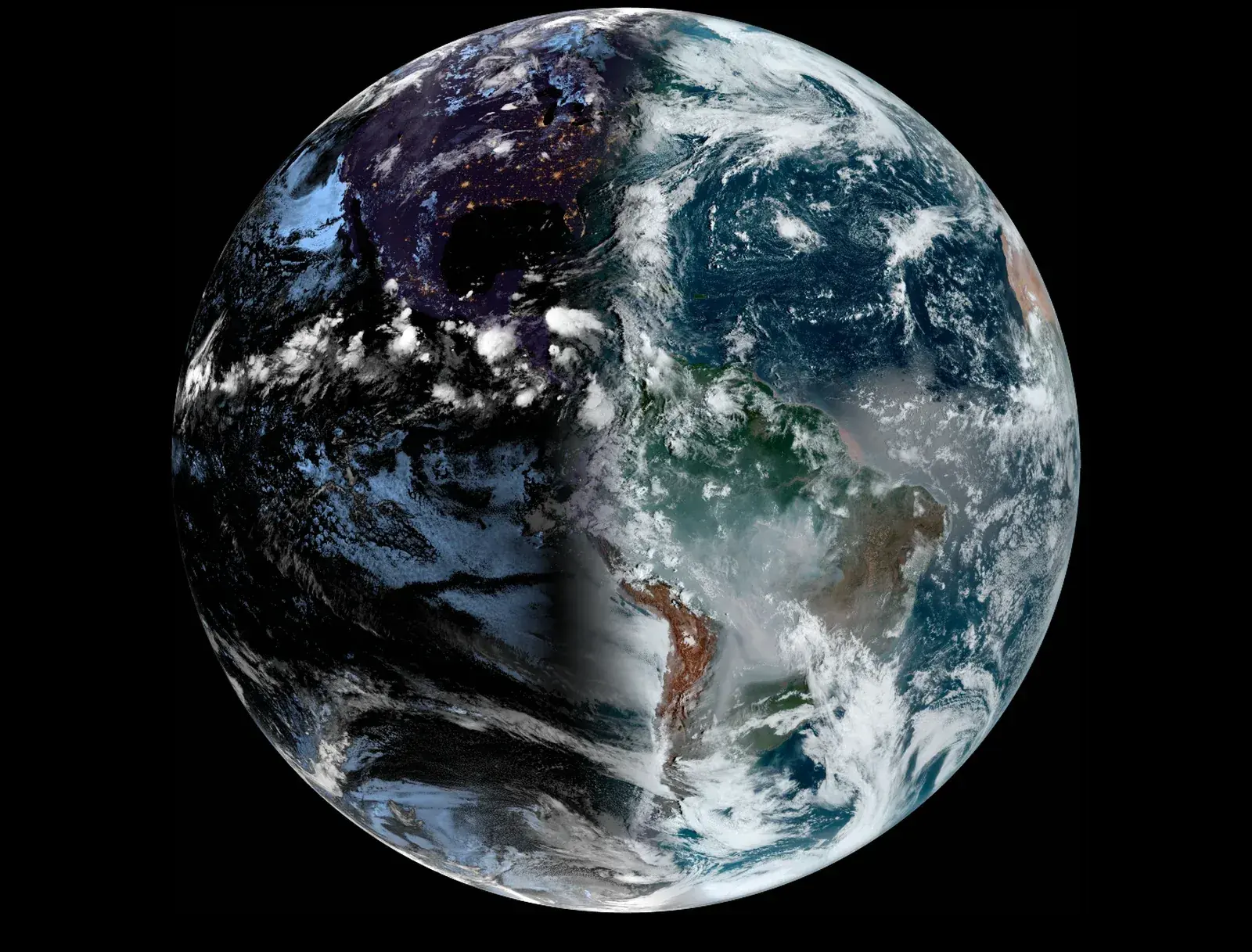 Satellite view of the Americas with the night side on the left and daylight on the right, split by a north to south line