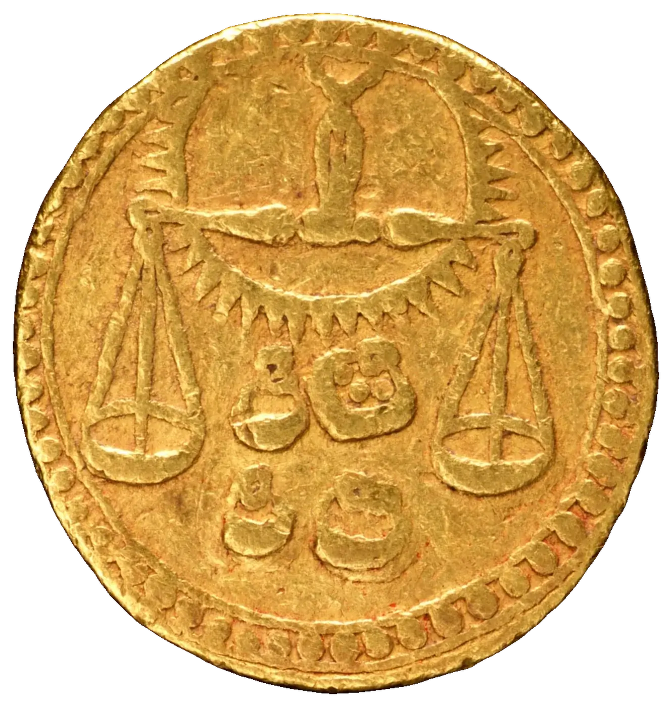 Gold coin stamped with a balance scale, the sign of Libra