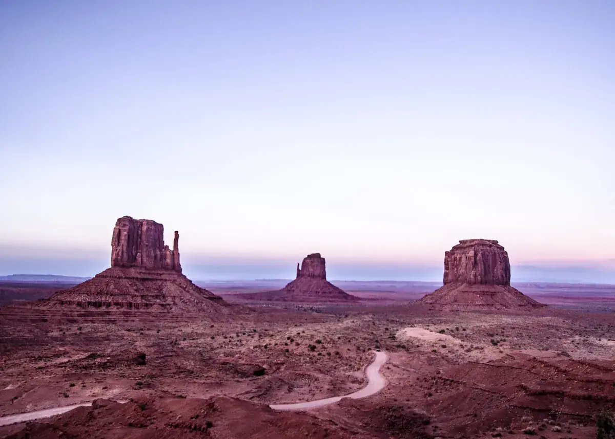 Desert buttes under a lavender dawn sky (Taurus and Sagittarius compatibility)
