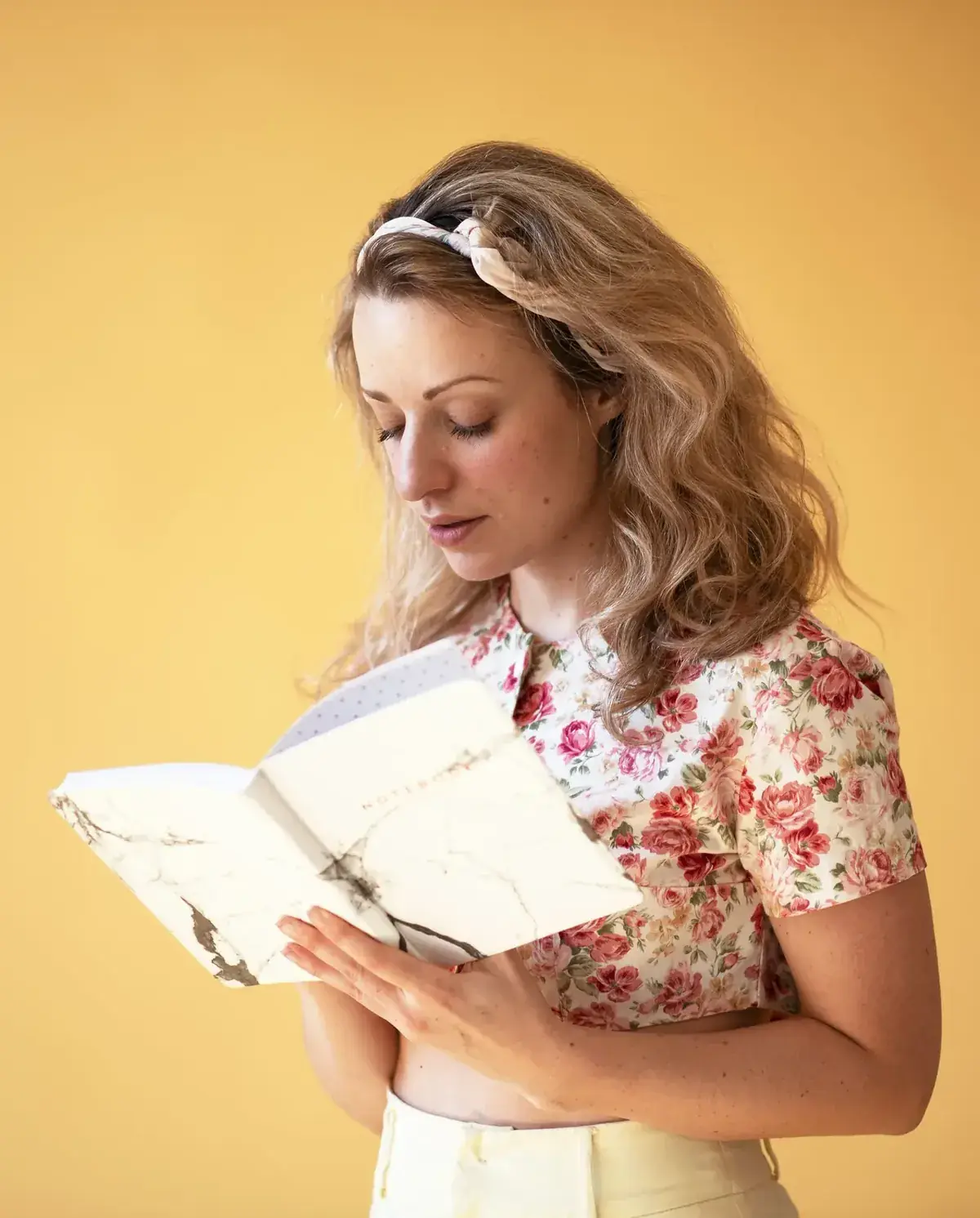 A young woman reading over her notes
