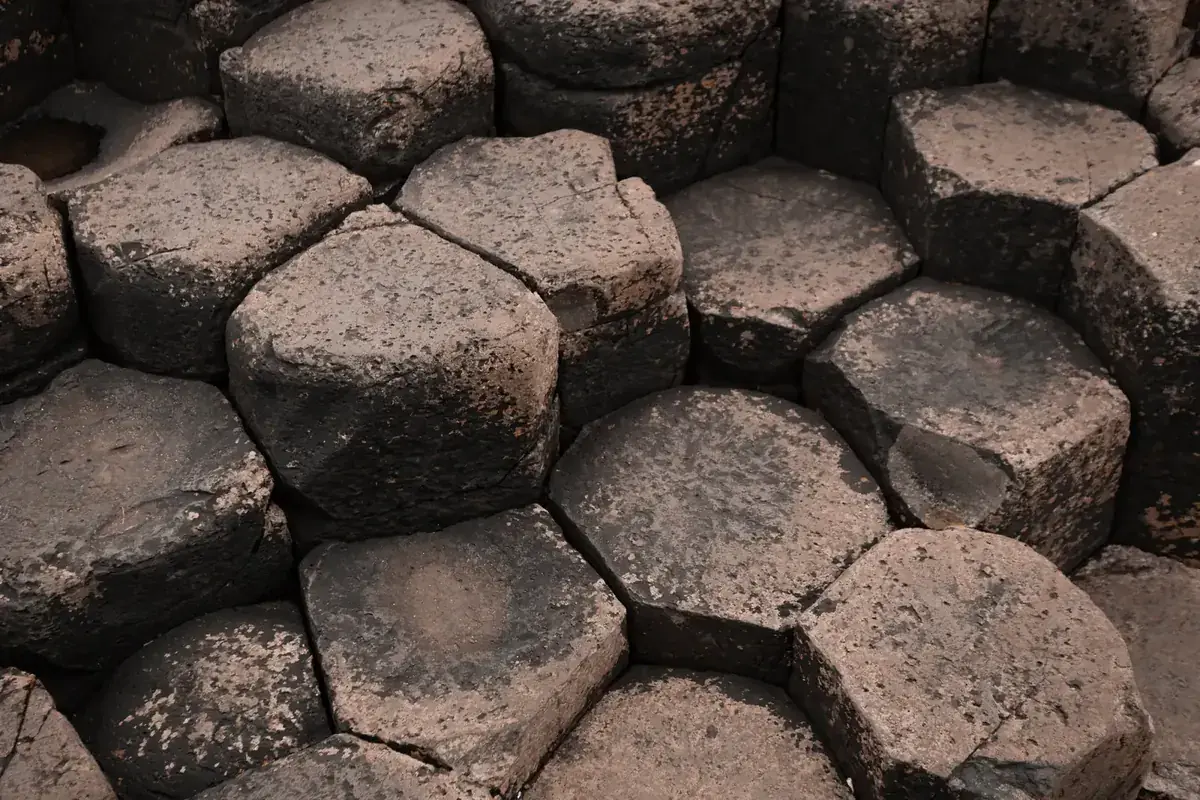 Close-up of interlocking hexagonal basalt columns (Taurus and Capricorn compatibility)