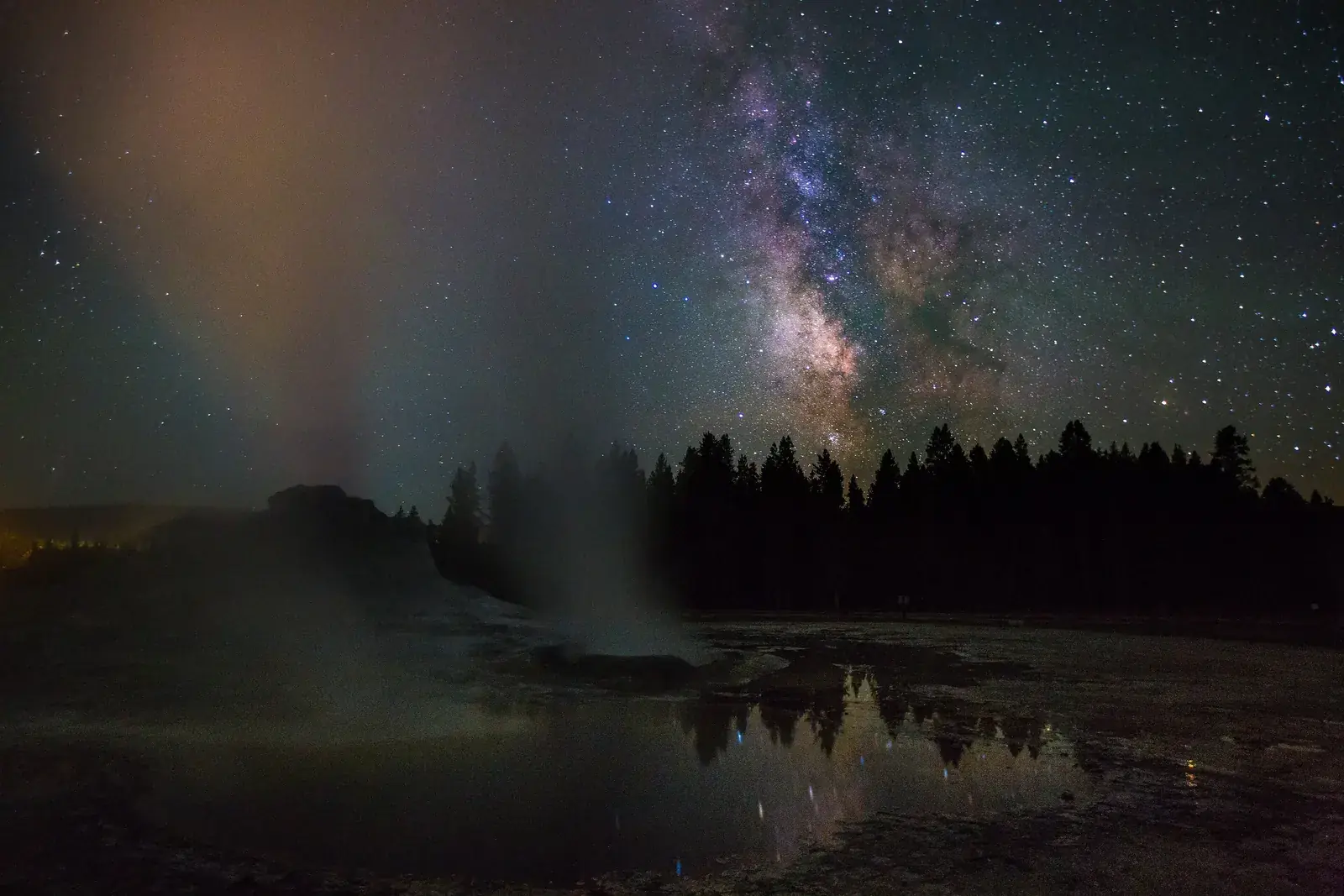 Steam from Castle Geyser drifting under the Milky Way