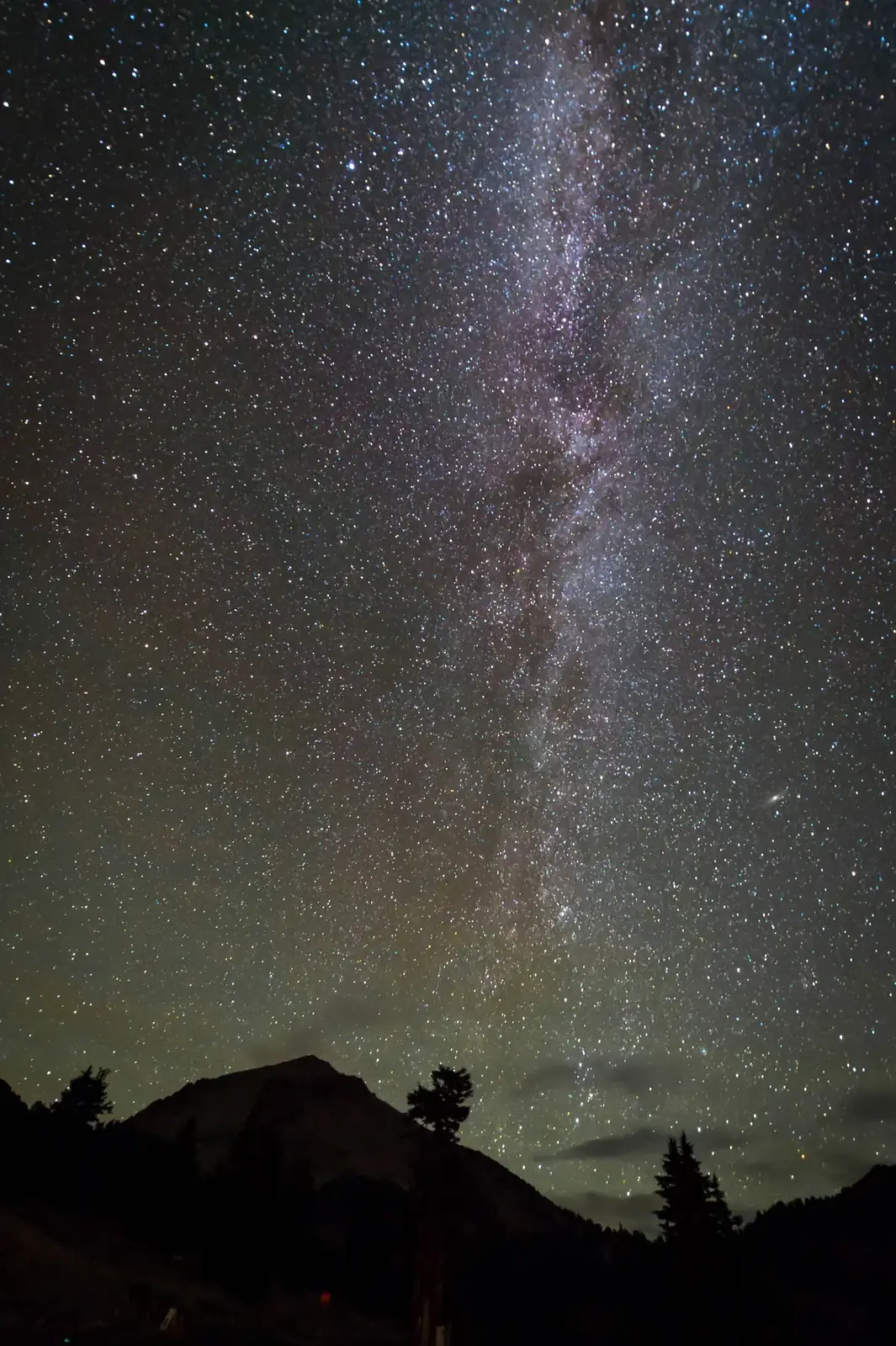 The Milky Way standing over the silhouette of Lassen Peak