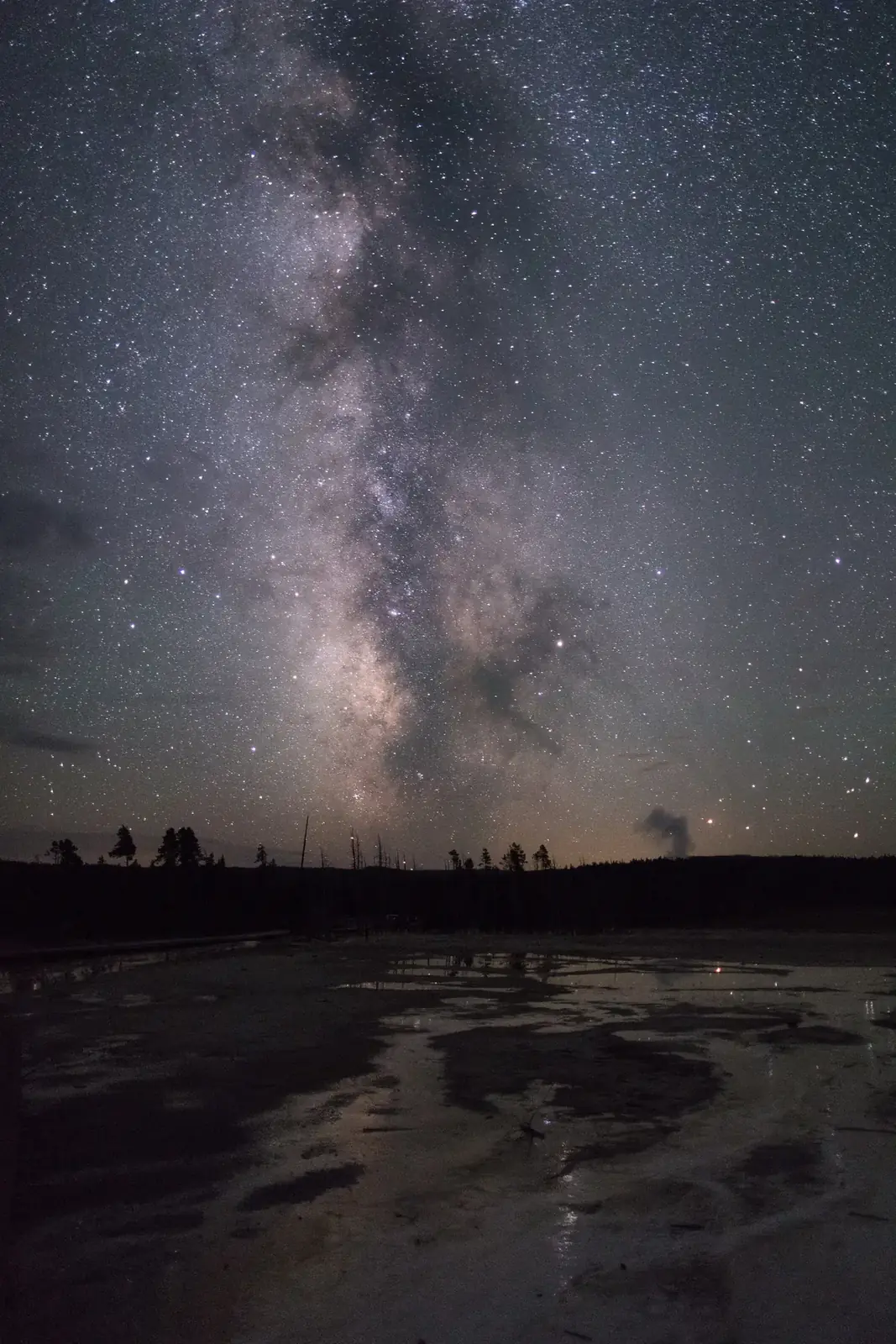 The Milky Way over the glassy runoff of Silex Spring